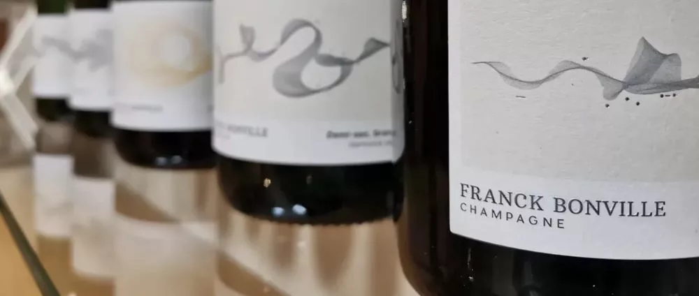 Franck Bonville Champagne bottles displayed in a row, showcasing the elegant label designs across the Grand Cru champagne collection.